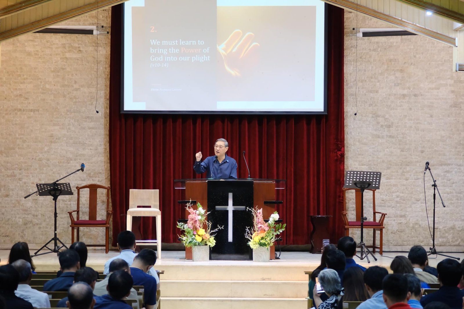 A man giving a sermon in a church.