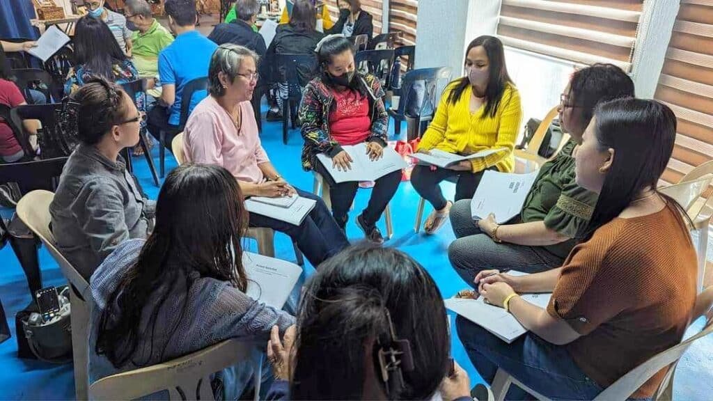 A group of people sitting around a table.