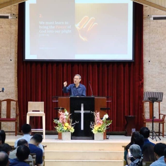 A man giving a sermon in a church.